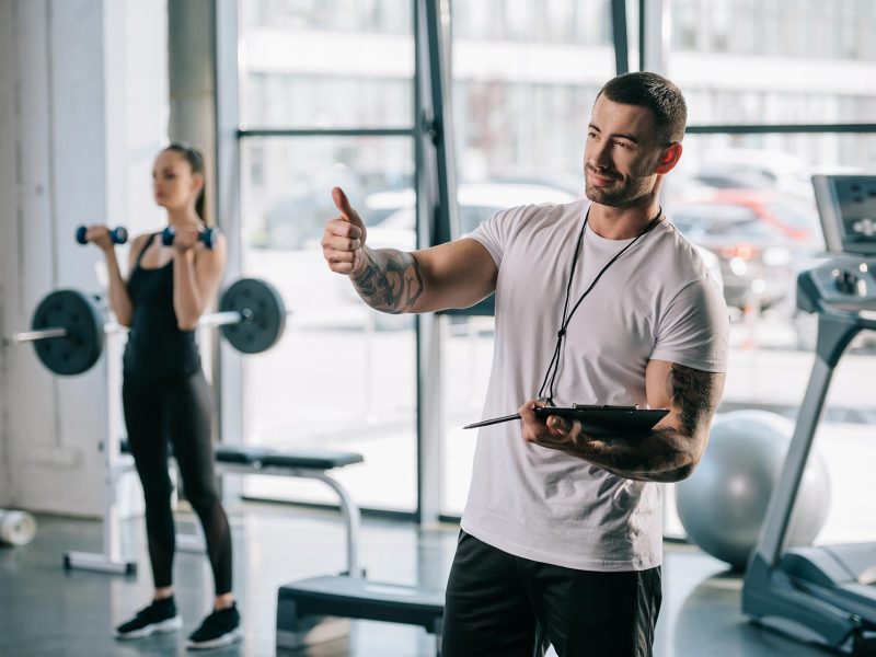 personal-trainer-doing-thumb-up-gesture-and-young-2024-11-18-06-14-37-utc personal-trainer-doing-thumb-up-gesture-and-young-2024-11-18-06-14-37-utc